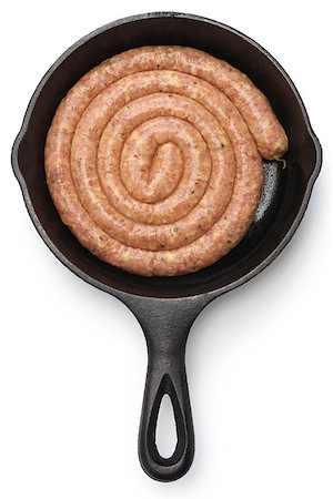 sausage coil - raw cumberland sausage, spiral pork sausage on skillet isolated on white background Stock Photo - Budget Royalty-Free & Subscription, Code: 400-08372501