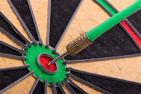 the dart hit the target on dartboard Stock Photo - Budget Royalty-Free & Subscription, Code: 400-08372890