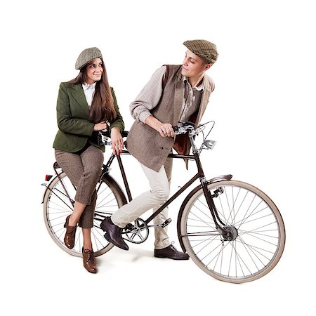 simsearch:400-06951810,k - Vintage dressed couple sitting on retro bike Stock Photo - Budget Royalty-Free & Subscription, Code: 400-08372945