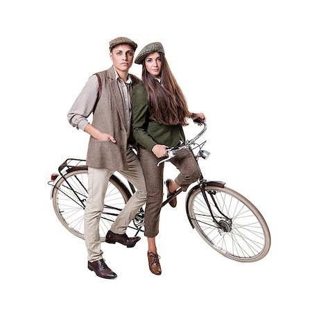 simsearch:400-06951810,k - Vintage dressed couple sitting on retro bike Stock Photo - Budget Royalty-Free & Subscription, Code: 400-08372943