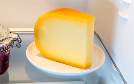 Cheese in the fridge with the door open. Stock Photo - Budget Royalty-Free & Subscription, Code: 400-08373189