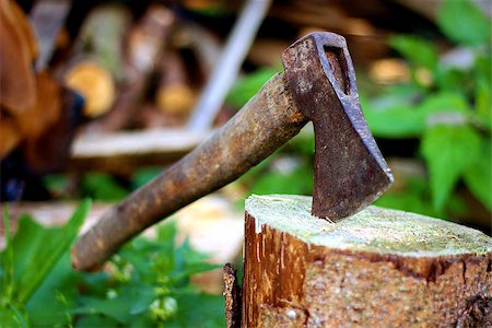 Old ax stuck in a tree stump. Retro style Stock Photo - Budget Royalty-Free & Subscription, Code: 400-08373419