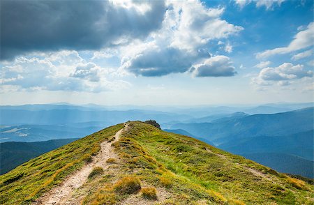 simsearch:400-05344522,k - Mountain top and path with dramatic clouds sky Photographie de stock - Aubaine LD & Abonnement, Code: 400-08373673