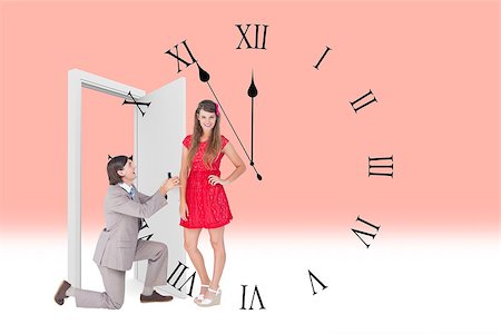 simsearch:400-08380053,k - Hipster on bended knee doing a marriage proposal to his girlfriend  against clock counting down to midnight Stockbilder - Microstock & Abonnement, Bildnummer: 400-08380049