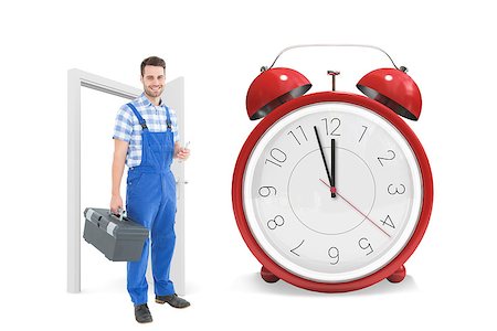 Male repairman carrying toolbox against alarm clock counting down to twelve Stock Photo - Budget Royalty-Free & Subscription, Code: 400-08380062