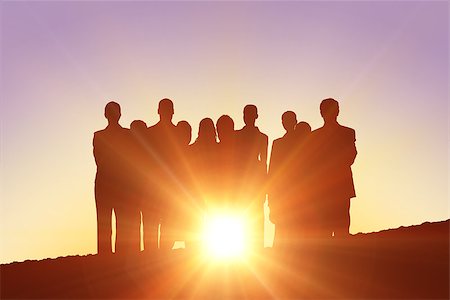Silhouettes standing against a sun set Stock Photo - Budget Royalty-Free & Subscription, Code: 400-08380168