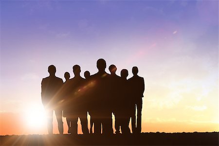 Silhouettes standing against sun shining Stock Photo - Budget Royalty-Free & Subscription, Code: 400-08380163