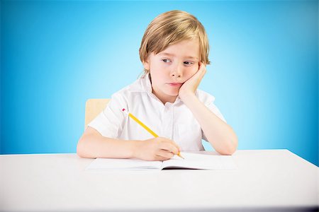 sad kids school uniform - Cute pupil thinking against blue background with vignette Stock Photo - Budget Royalty-Free & Subscription, Code: 400-08380256