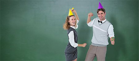 simsearch:400-08380794,k - Geeky couple dancing with party hat  against green chalkboard Stockbilder - Microstock & Abonnement, Bildnummer: 400-08380642