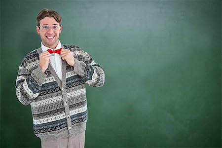 simsearch:400-08380794,k - Happy geeky hipster with wool jacket  against green chalkboard Stockbilder - Microstock & Abonnement, Bildnummer: 400-08380673