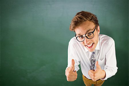 simsearch:400-08020381,k - Young geeky businessman showing thumbs up against green chalkboard Fotografie stock - Microstock e Abbonamento, Codice: 400-08380770