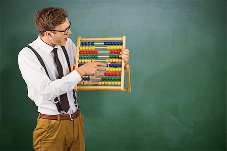Geeky businessman using an abacus against green chalkboard Stock Photo - Budget Royalty-Free & Subscription, Code: 400-08380785