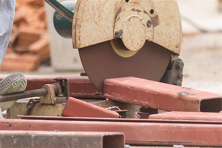 simsearch:400-06692901,k - Worker cutting metal with grinder in construction site. Sparks while grinding iron Foto de stock - Super Valor sin royalties y Suscripción, Código: 400-08399752