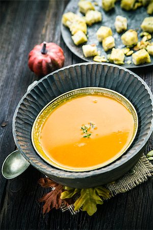 simsearch:400-06429990,k - Vegetarian food concept. Pumpkin soup with pumpkin seeds, croutons and garnish on wooden background Stock Photo - Budget Royalty-Free & Subscription, Code: 400-08399833