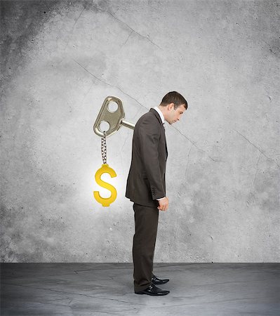 simsearch:400-04486166,k - Businessman looking down with key in back on grey background Stockbilder - Microstock & Abonnement, Bildnummer: 400-08404215