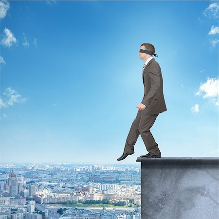 simsearch:400-04486166,k - Man walking from edge of building roof with band on his eyes Stockbilder - Microstock & Abonnement, Bildnummer: 400-08404231