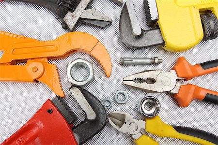 Hand tools  wrenches, pliers, nuts close up Foto de stock - Super Valor sin royalties y Suscripción, Código: 400-08404906