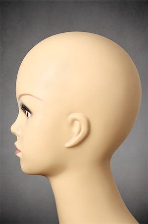 Closeup of a female manikin head on gray background Stock Photo - Budget Royalty-Free & Subscription, Code: 400-08405403