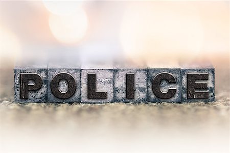 The word "POLICE" written in vintage ink stained letterpress type. Stock Photo - Budget Royalty-Free & Subscription, Code: 400-08406078