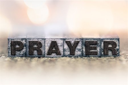 The word "PRAYER" written in vintage ink stained letterpress type. Photographie de stock - Aubaine LD & Abonnement, Code: 400-08406079