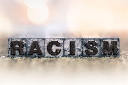 The word "RACISM" written in vintage ink stained letterpress type. Stockbilder - Microstock & Abonnement, Bildnummer: 400-08406090