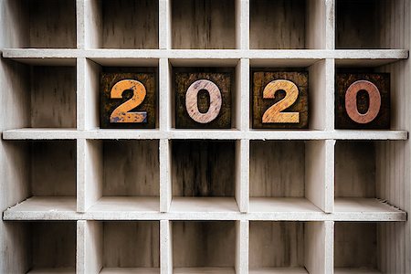 The word "2020" written in vintage ink stained wooden letterpress type in a partitioned printer's drawer. Stock Photo - Budget Royalty-Free & Subscription, Code: 400-08406127