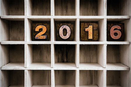 The word "2016" written in vintage ink stained wooden letterpress type in a partitioned printer's drawer. Stock Photo - Budget Royalty-Free & Subscription, Code: 400-08406123
