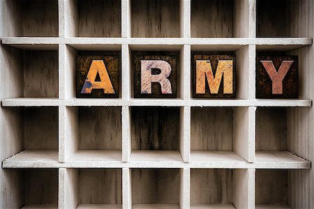 simsearch:400-08407049,k - The word "ARMY" written in vintage ink stained wooden letterpress type in a partitioned printer's drawer. Foto de stock - Super Valor sin royalties y Suscripción, Código: 400-08406134