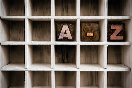 simsearch:400-08407055,k - The letters "A-Z" written in vintage ink stained wooden letterpress type in a partitioned printer's drawer. Foto de stock - Super Valor sin royalties y Suscripción, Código: 400-08406138