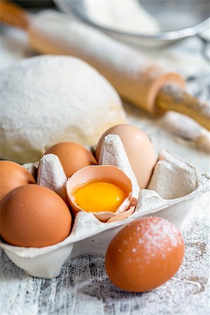 eggs milk - Tray with eggs, dough and rolling pin on the kitchen table. Stock Photo - Budget Royalty-Free & Subscription, Code: 400-08407425