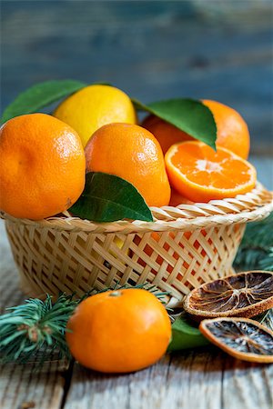 fruit winter basket - Basket with citrus and spruce branches on a wooden table. Stock Photo - Budget Royalty-Free & Subscription, Code: 400-08407422