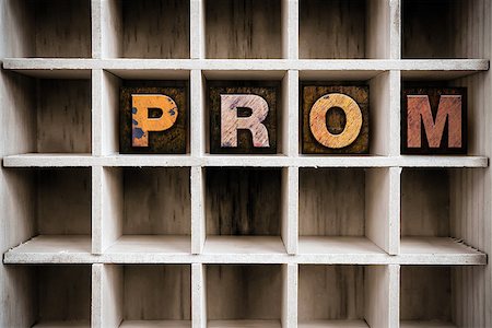 The word "PROM" written in vintage ink stained wooden letterpress type in a partitioned printer's drawer. Stock Photo - Budget Royalty-Free & Subscription, Code: 400-08408189