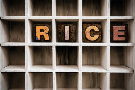 simsearch:400-08407055,k - The word "RICE" written in vintage ink stained wooden letterpress type in a partitioned printer's drawer. Foto de stock - Super Valor sin royalties y Suscripción, Código: 400-08408204