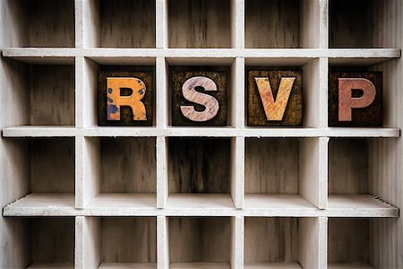 simsearch:400-08407055,k - The word "RSVP" written in vintage ink stained wooden letterpress type in a partitioned printer's drawer. Foto de stock - Super Valor sin royalties y Suscripción, Código: 400-08408206