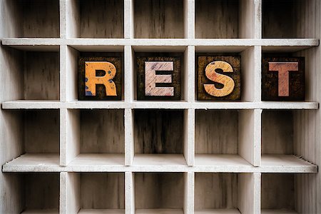 simsearch:400-08407049,k - The word "REST" written in vintage ink stained wooden letterpress type in a partitioned printer's drawer. Foto de stock - Super Valor sin royalties y Suscripción, Código: 400-08408202