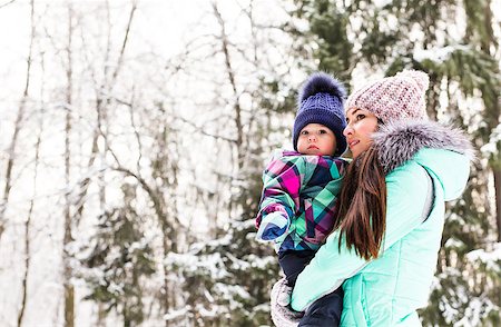 happy family mother and child baby daughter on a winter walk in the woods. Photographie de stock - Aubaine LD & Abonnement, Code: 400-08408231