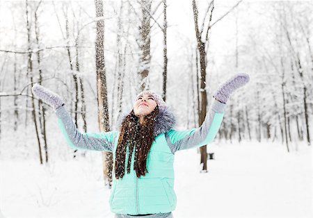 person falling in the wind - Happy young woman having fun in the snow. Stock Photo - Budget Royalty-Free & Subscription, Code: 400-08409073