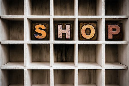 simsearch:400-08290801,k - The word "SHOP" written in vintage ink stained wooden letterpress type in a partitioned printer's drawer. Stock Photo - Budget Royalty-Free & Subscription, Code: 400-08409116