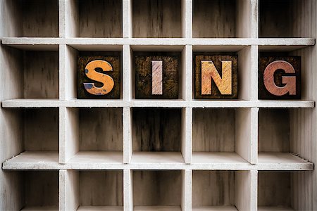 singing carols - The word "SING" written in vintage ink stained wooden letterpress type in a partitioned printer's drawer. Stock Photo - Budget Royalty-Free & Subscription, Code: 400-08409119