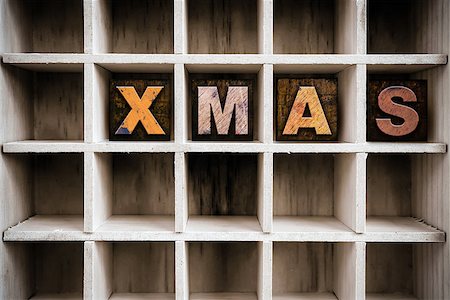 simsearch:400-08407049,k - The word "XMAS" written in vintage ink stained wooden letterpress type in a partitioned printer's drawer. Foto de stock - Super Valor sin royalties y Suscripción, Código: 400-08409130