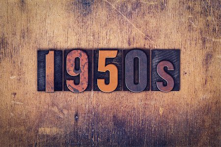 The word "1950s" written in dirty vintage letterpress type on a aged wooden background. Stock Photo - Budget Royalty-Free & Subscription, Code: 400-08409385