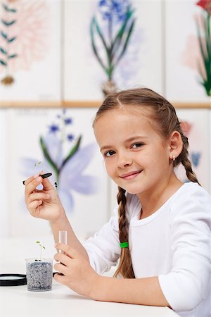 plant inside a test tube - Young girl with seedling for study in biology class - holding a small plant and smiling Stock Photo - Budget Royalty-Free & Subscription, Code: 400-08400010