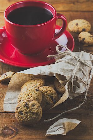 simsearch:400-06142439,k - cup of coffee and oatmeal cookies with chocolate on the wooden table. background. vertical. toning Stock Photo - Budget Royalty-Free & Subscription, Code: 400-08400238