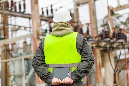 power station control - Electrician with tablet PC in electrical substation Stock Photo - Budget Royalty-Free & Subscription, Code: 400-08400981
