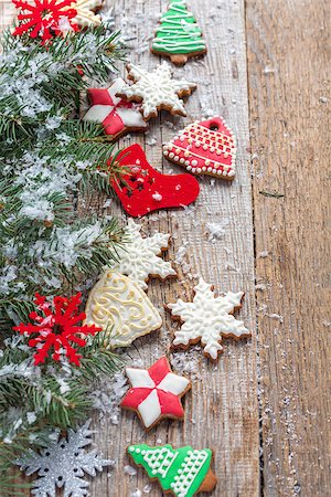 Christmas cookies, decorations and spruce branches on a wooden background. Stock Photo - Budget Royalty-Free & Subscription, Code: 400-08401005