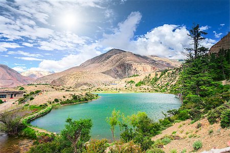 Beautiful lake in mountains against blue sky with white clouds in Annapurna area Stock Photo - Budget Royalty-Free & Subscription, Code: 400-08401064