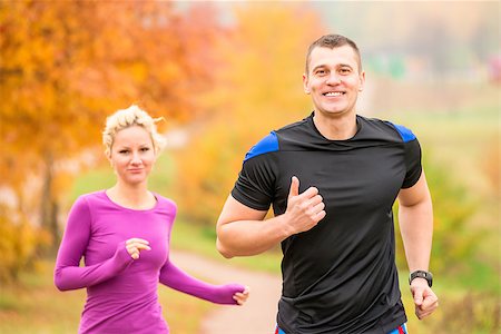 cheerful young athletes jogging autumn morning Stock Photo - Budget Royalty-Free & Subscription, Code: 400-08401544