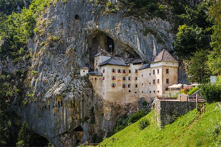 simsearch:400-05119652,k - Renaissance Castle Built Inside Rocky Mountain in Predjama, Slovenia. Famous Tourist Place in Europe. Stock Photo - Budget Royalty-Free & Subscription, Code: 400-08401714
