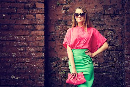 simsearch:400-08430017,k - Beautiful Fashionable Woman Standing at the Old Brick Wall Background. Urban Fashion Concept. Toned Photo with Copy Space. Stock Photo - Budget Royalty-Free & Subscription, Code: 400-08401935