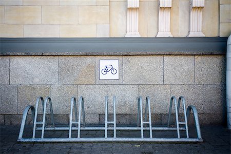 empty modern road - Metal bike rack by the tiled wall Stock Photo - Budget Royalty-Free & Subscription, Code: 400-08402063